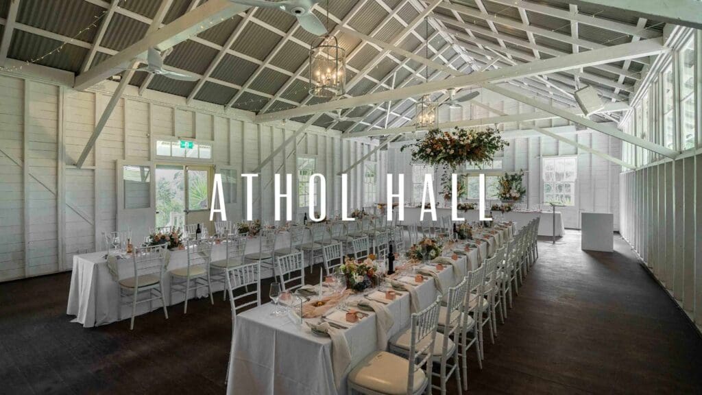 Athol Hall Sydney wedding venue set up with long tables and a ceiling floral installation