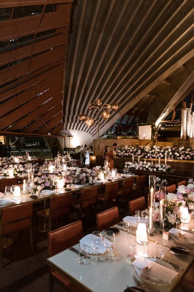Bennelong Restaurant Sydney Opera House wedding venue styled for a wedding with pillar candles and pink and white florals