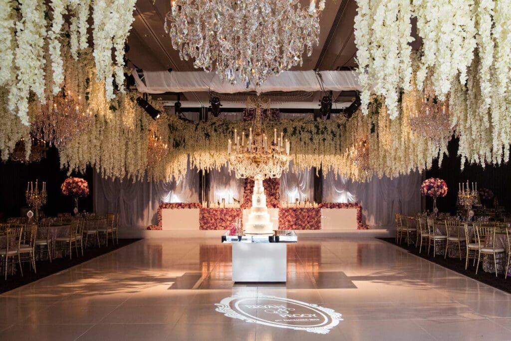 Curzon Hall wedding venue setup with hanging wisteria and ornate chandeliers