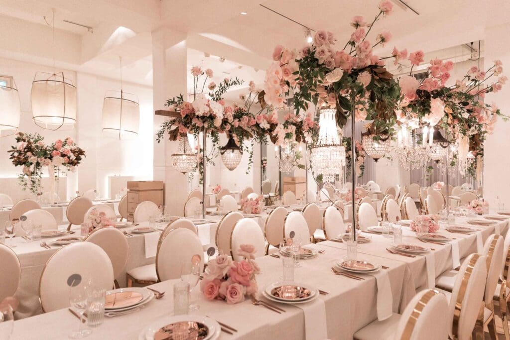Events by Alpha wedding venue setup with pink florals and chandeliers for a wedding in Sydney