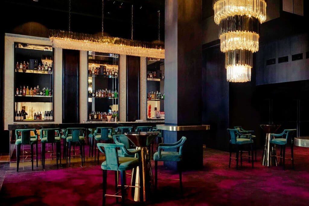 The highline venue in Bankstown featuring red carpet and a large gold chandelier in front of a regal bar