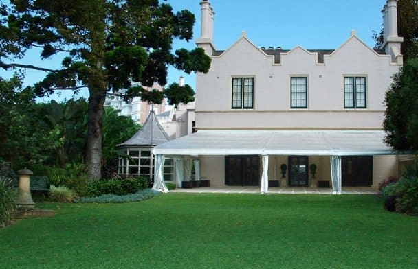 Lindesay House mansion in Darling Point overlooking the Sydney Harbour with a lush green grass