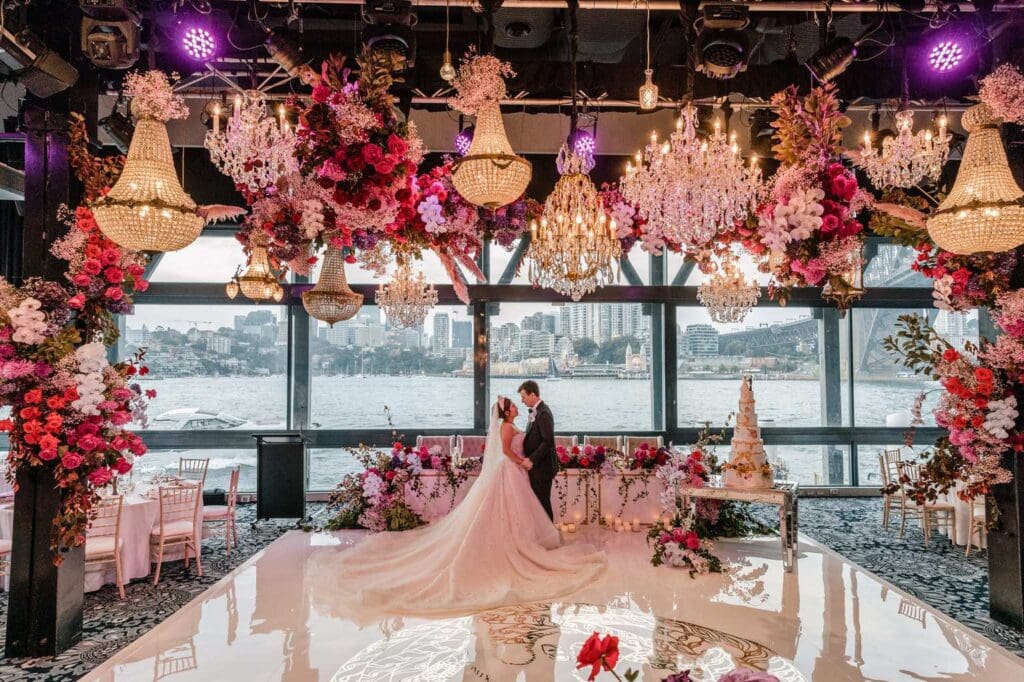 Pier One Sydney Harbour Hotel wedding venue styled with pink and white florals and ornate chandeliers