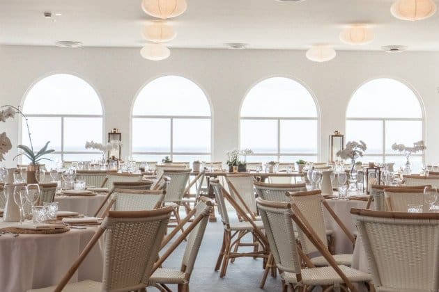The Blue Room Bondi Beach wedding venue with arch windows and wicker chairs