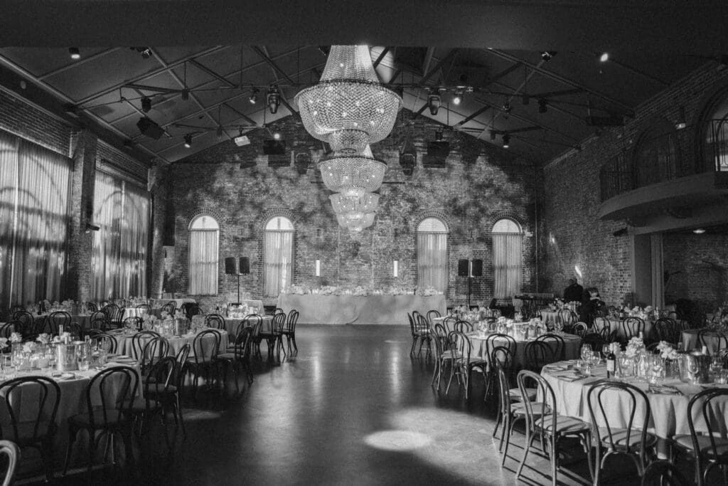 The linseed house wedding venue featuring brick feature wall and chandeliers