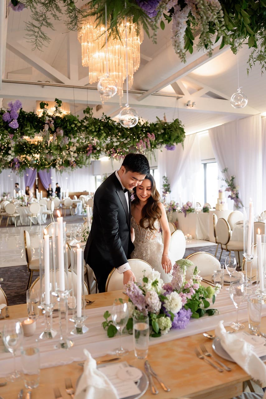 Bride and groom admiring their wedding table styling at Sergents Mess Sydney wedding venue